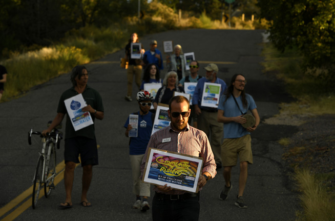 DENVER, CO - SEPTEMBER 23: Nick Thomas, who is running for Colorado's 2nd congressional district as an independent candidate, joined with other activists taking part in a rally and march to support Proposition 112 on September 23, 2018 in Denver, Colorado. The group rallied at Inspiration Point, across from Willis Case Golf Course, and then marched, with their signs chanting against fracking, to the home of former Secretary of the Interior Ken Salazar who lives in the area. The activists, who support the ballot measure that calls for oil and gas setbacks of 2500 feet from homes and schools, were protesting a Democratic party fundraiser held by Salazar for gubernatorial candidate Jared Polis. The group said they are picketing Polis because he does not support the measure. (Photo by Helen H. Richardson/The Denver Post)